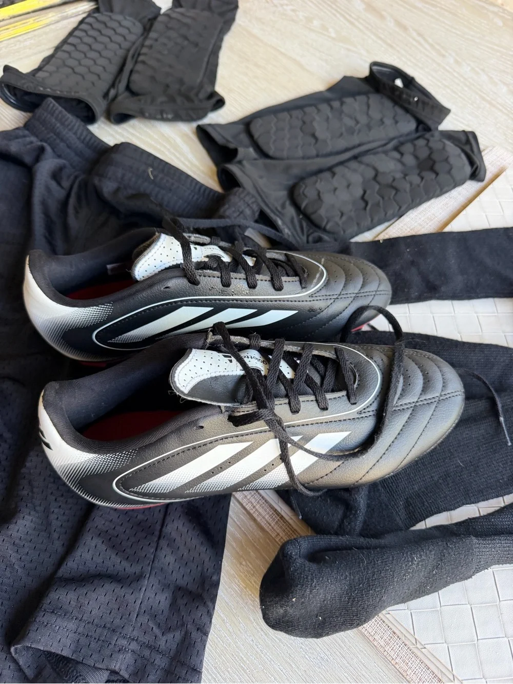 Black Men's Soccer Cleats with White Accents